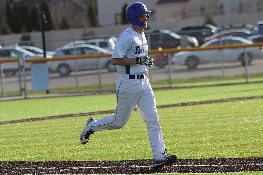 Ray Hilbrich (10) runs to first base. Hilbrich plays for the JV baseball team. Photo by: Hannah Hill