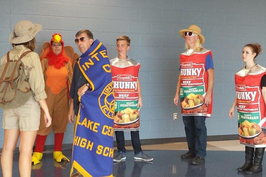 Mr. Tom Clark, Social Studies, Mr. Ron Fredrick, English and several Interact members prepare to film the 2016 Food Drive commercial. The Food Drive was one of many Interact projects carried out this year and has been a tradition for nearly three decades at Lake Central. Photo submitted by: Duaa Hijaz (12) 
