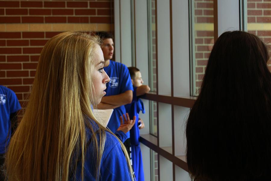 Taking in the third floor views, Julia Jacobson (9) gets comfortable with her home for the next four years. The Class of 2020 was invited to Freshman Rush so they could get oriented with the school before the first day. 
