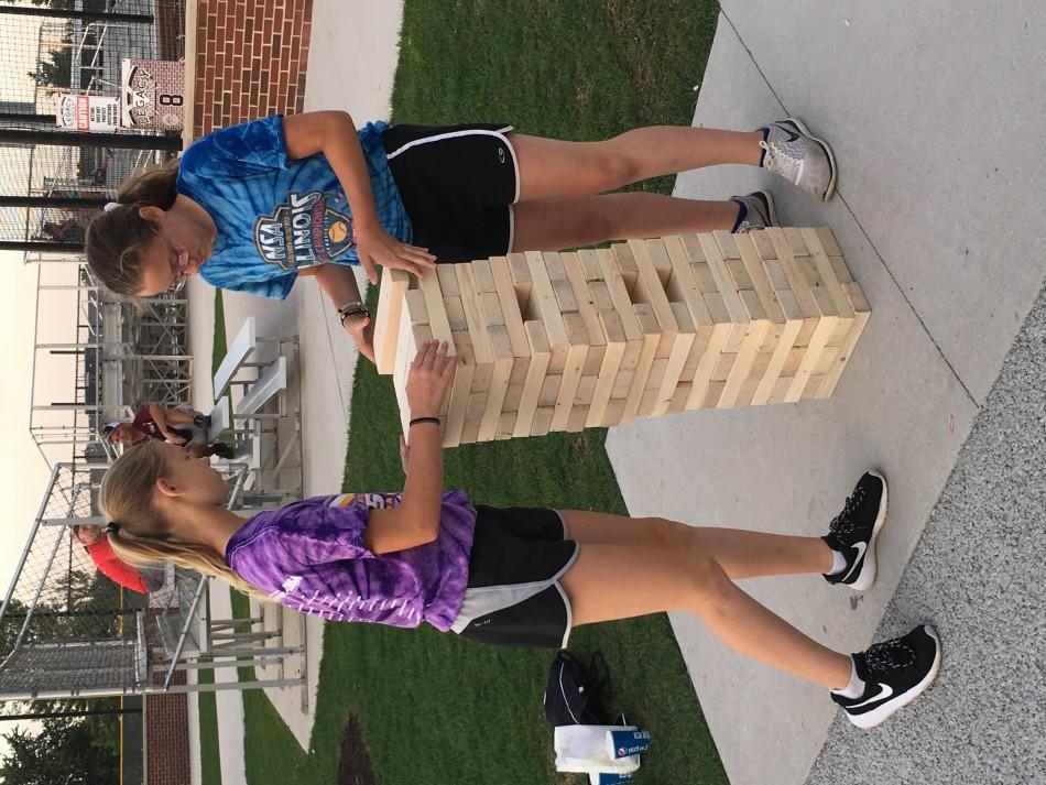 Two+girls+play+Jenga+together+during+the+block+party.+The+block+party+was+held+from+6%3A30-10+p.m.+