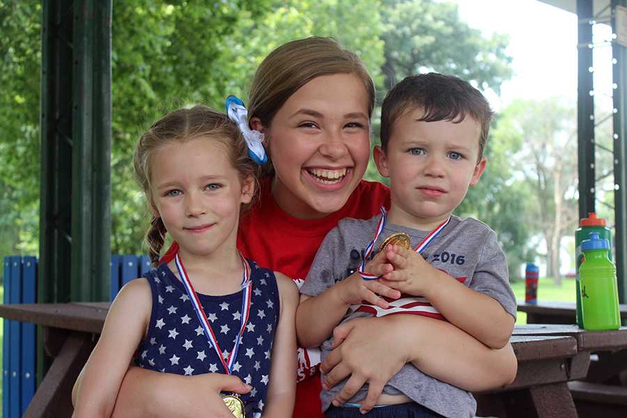 Katherine Morzy (10) poses with two campers on the last day of camp. This was Morzy’s third year volunteering. 
