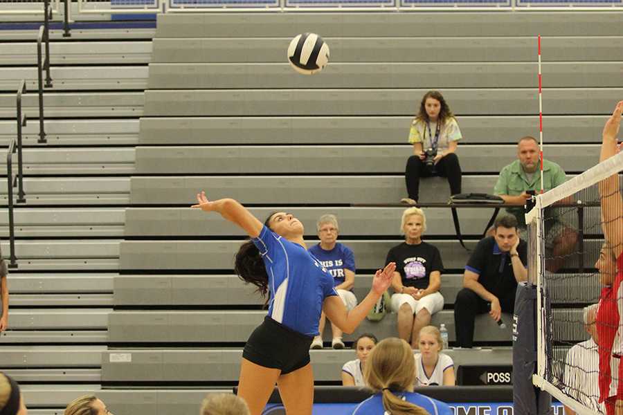 Linda Morton (12) spikes the ball.  Her skills gained LC one point.