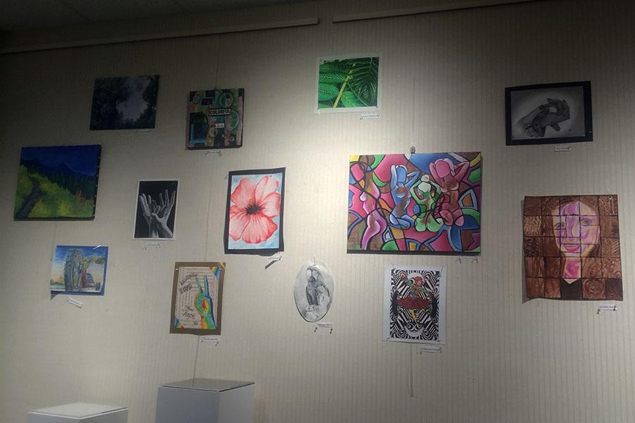 Works+of+art+hang+on+the+walls+of+the+librarys+art+gallery.++Art%E2%80%8B+was+painted+by+students+at+Lake+Central.%0A