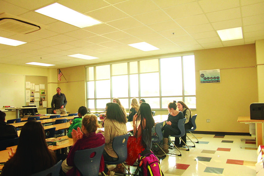 The members of the Future Medical Professionals club applaud the guest speaker. Mr. William Keep, Business, thanked the anesthesiologist for advising the members of the club. 
