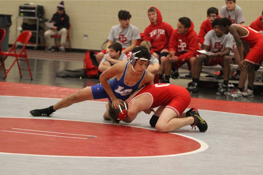 +Going+in+for+a+take+down%2C+this+freshman+wrestler+scores+himself+a+personal+point.+This+match+involved+many+other+takedowns+and+neutral+stances.%0A
