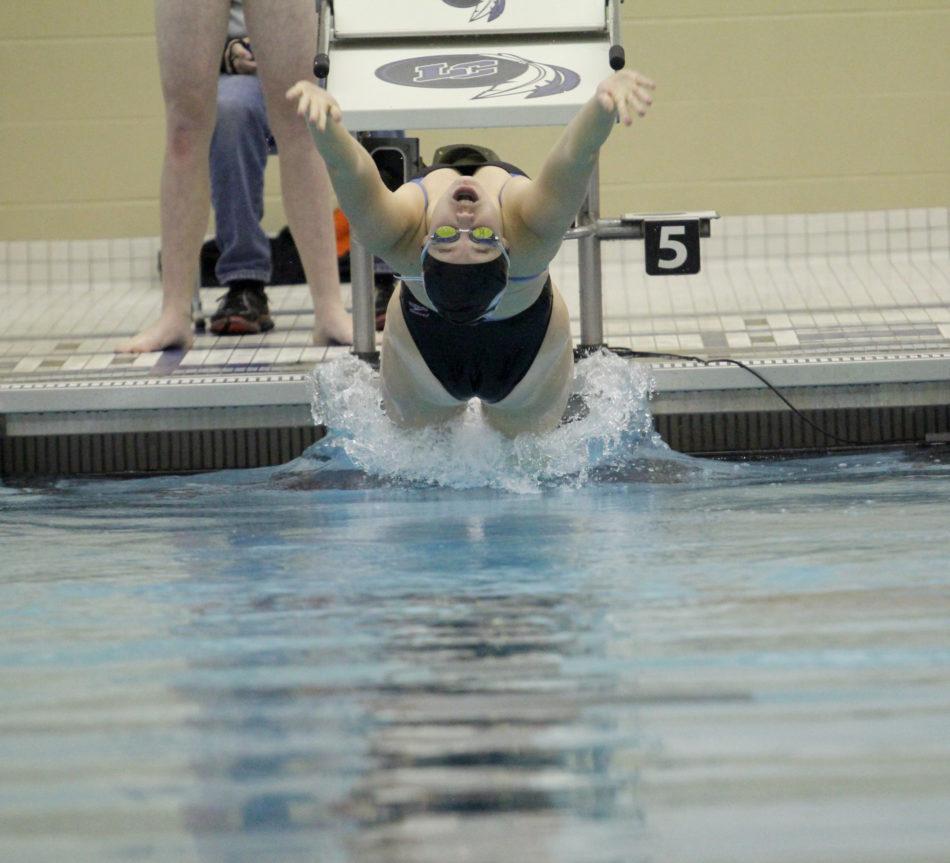 Jillian Murray (10) reaches backwards after hearing the sound to start backstroke. Murray was placed first in three of her four events.