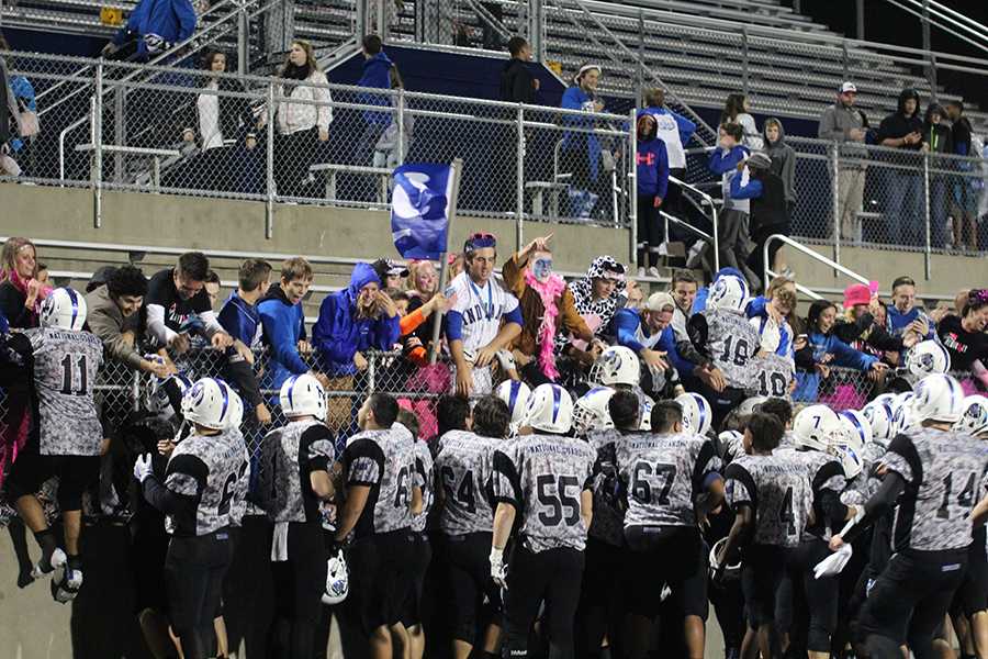 Students show school spirit with the Indian Mascot at a football game. Lake Central has had the Indian mascot for over 50 years. 