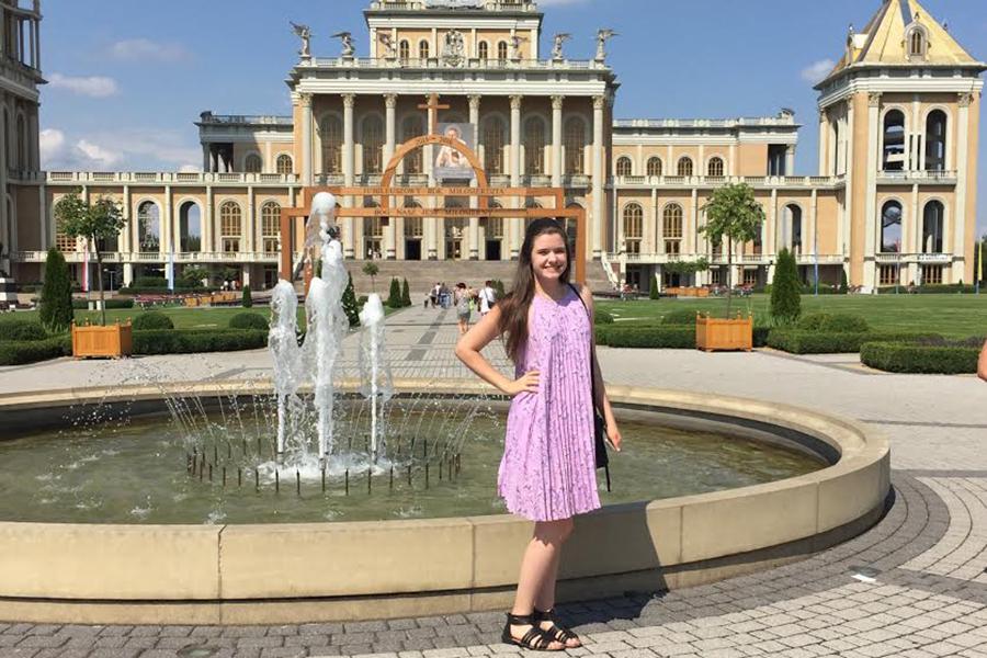 Isabella Kowalcyzk (11) poses by a church in Poland. She continued her time visiting her favorite cities. Photo submitted by Isabella Kowalcyzk (11).