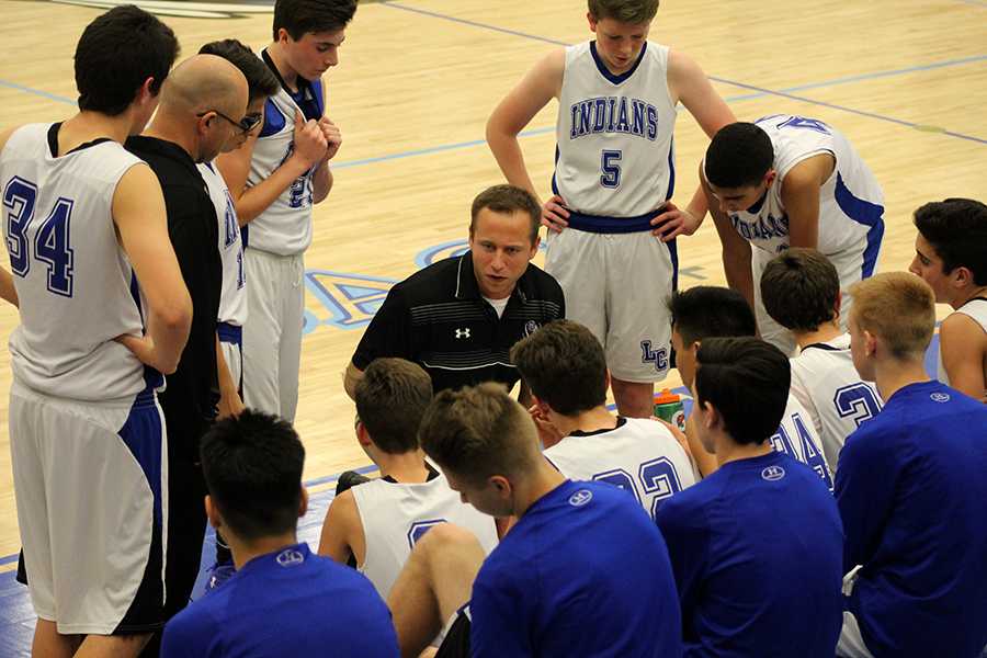 Coach Mr. Stephan Fry talks to the boys during half time. The score at that time was 10-15 with the Lake Central Indians in the lead.


