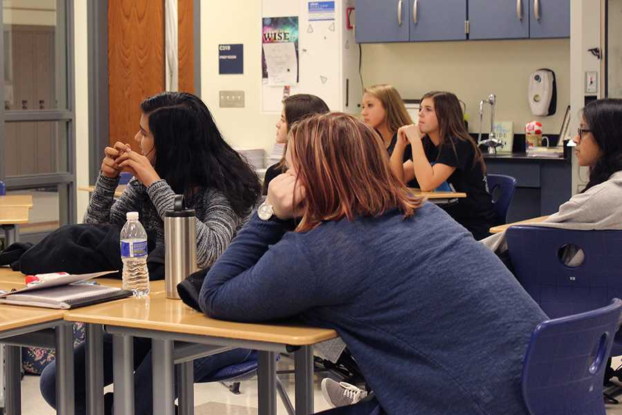 Students listen to the presentation about college decisions. The presentation is part of a lecture circuit of women going into the STEM field or those who are currently a part of it.
