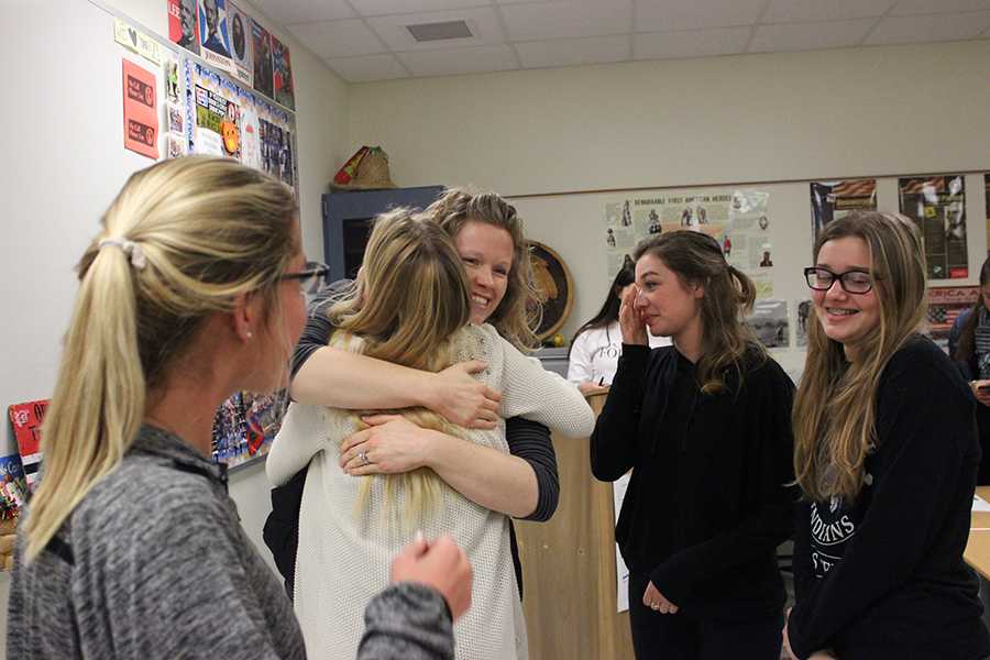 Mrs. Katelin Ellis, Science, wishes her former tennis team the best of luck with hugs. The girls surrounded the teacher and waited to say their goodbyes.