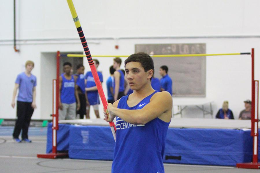 Doug Devries (12) gets ready to pole vault at the track meet. Devries has been pole vaulting since his junior year.