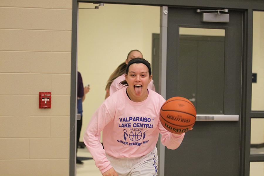  Faith Maldonado (12) comes running out of the locker rooms ready to play. This is Maldonado’s fourth year playing girls basketball.