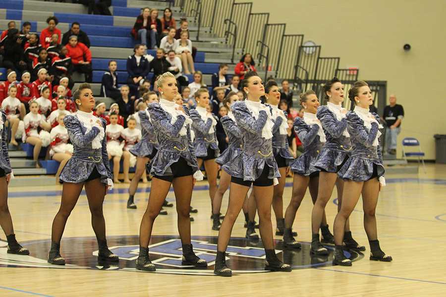 The varsity Centralettes take their places before performing their hip-hop routine. The invitational took place in the gymnasium on Saturday. 