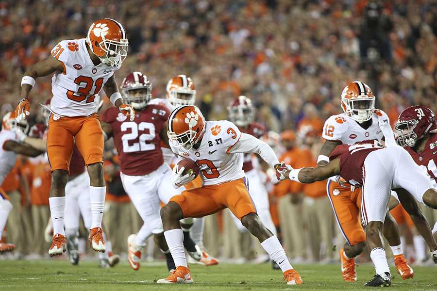Clemson Tigers wide receiver Artavis Scott (3) runs the ball as Clemson Tigers safety Kyle Cote (32) looks on during the first quarter against the Alabama Crimson Tide during the College Football Playoff National Championship on Monday, Jan. 9, 2017 at Raymond James Stadium in Tampa, Fla. (Loren Elliott/Tampa Bay Times/TNS)