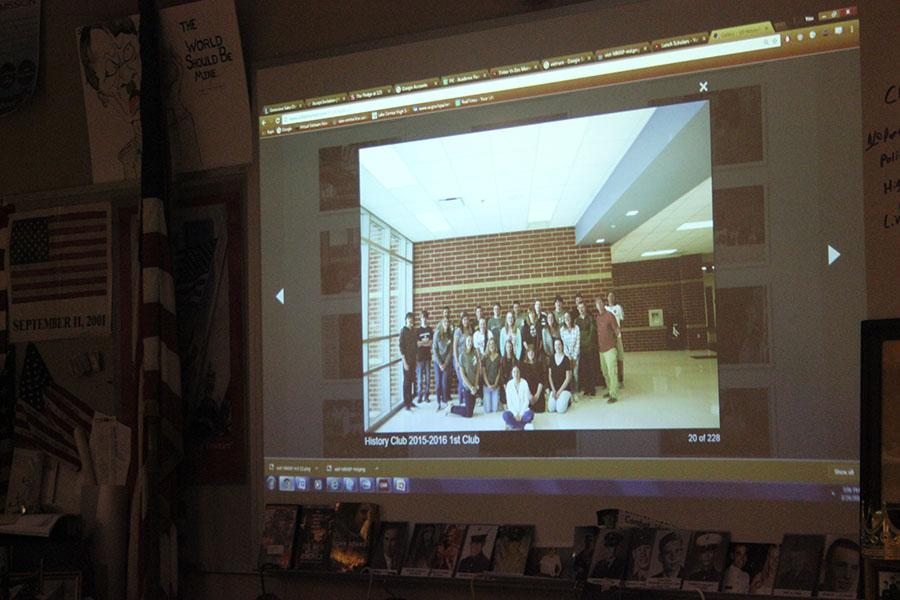 Tom Clark (Social Studies) shows the club last year’s club photo. The 2015-2016 school year was the History Club’s first year.