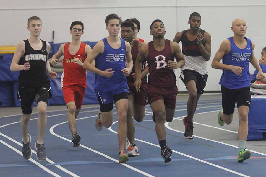 Andrew Ackerman (12) and Issac Beatty (10) lead the pack of runners. Beatty competed in the long jump as well as the mile. 
