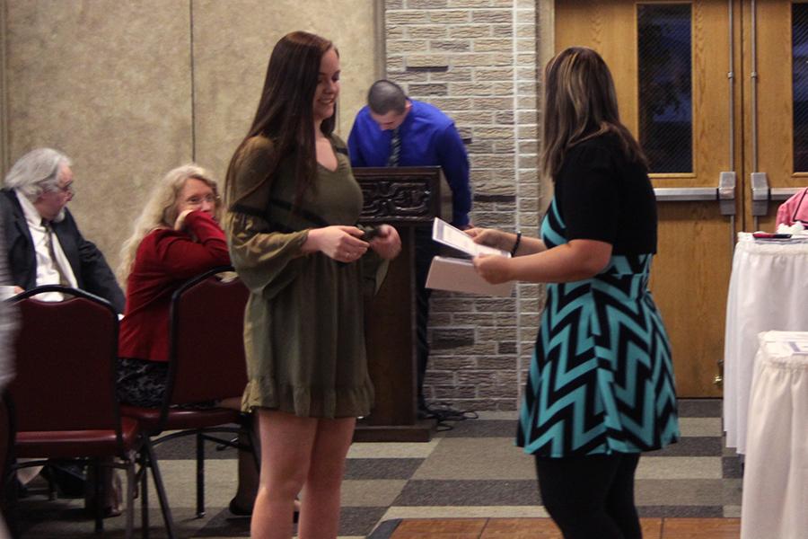Marissa Denys (10) receives her certificate. The banquet lasted an hour and a half. 
