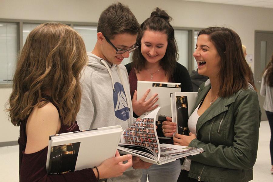  A group of sophomores laugh as they look through the yearbook. The theme of this years book was “What’s the Big Deal?” 