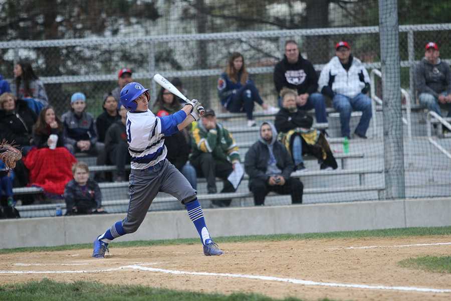 Jarrett Lopez (12) swings the bat attempting to hit the ball. Lake Central lost to Munster in last years sectionals.
