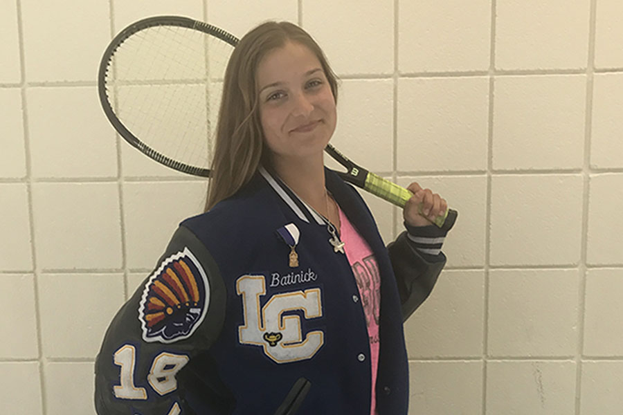 Sydney Batnick(11) poses with her tennis equipment. She  attended one of her last practices of the season. 