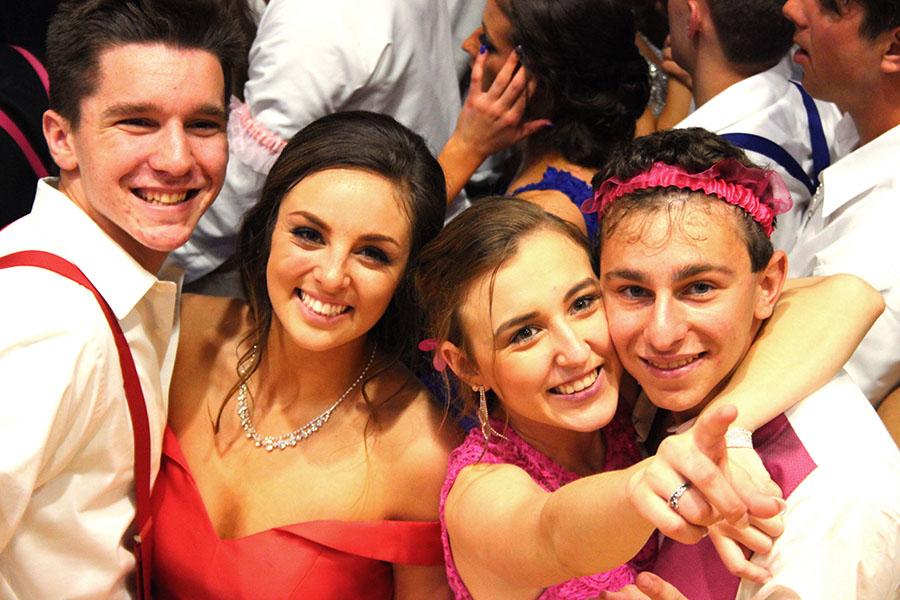 Daniel Picioski (12), Rylee Platusic (11), Molly Stokes (11) and Christopher Baranowski (12) grin at the cameras. Prom was the last dance of the school year.
