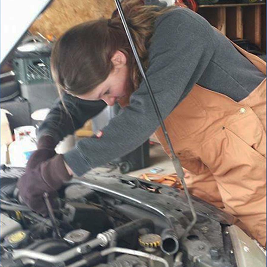 Madilynn+Mathison+%2811%29+works+on+a+car+in+her+garage.+Mathison+worked+with+her+dad+to+try+to+fix+the+car.