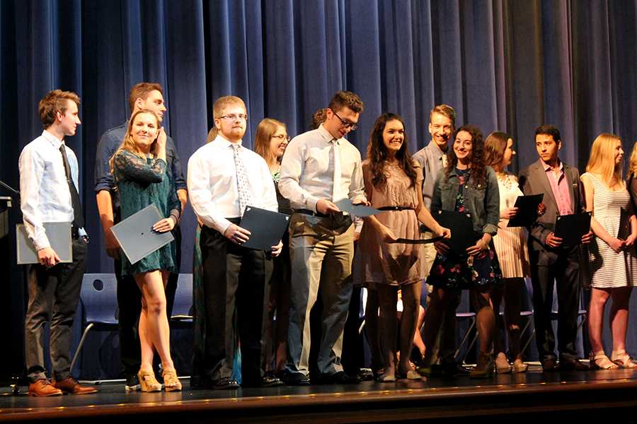 Students gather on stage to receive their James & Betty Dye Foundation scholarship award. This was the first of many scholarships awarded that night. 