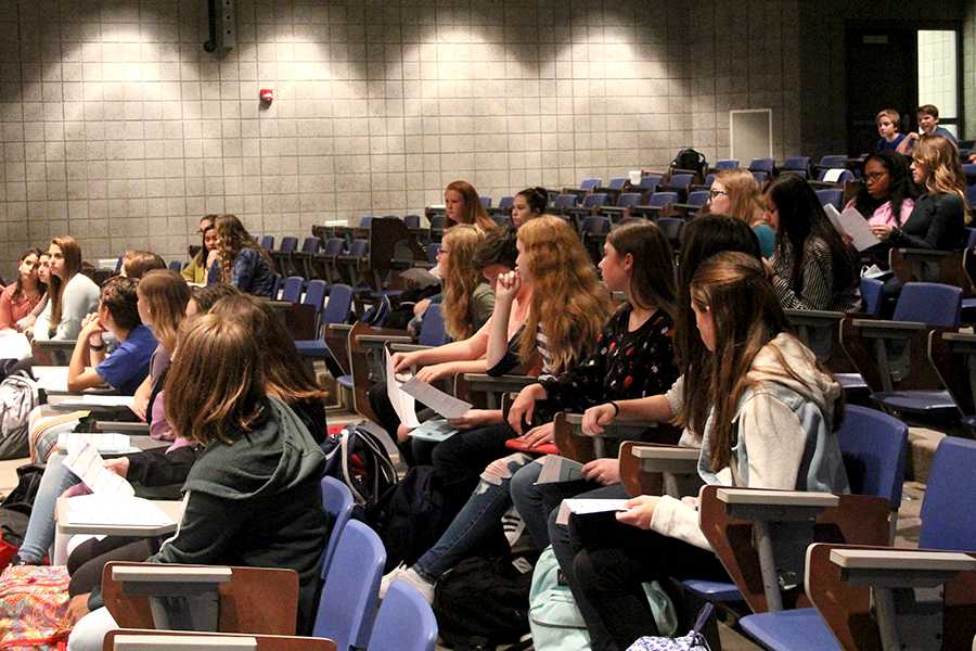 Eliza Hoeckleberg (9) and the other members of her class attentively listen. Mrs. Robin May, counselor, and Mrs. Jamie Rodgers, counselor, explained fundraisers for the class of 2021’s school dances.