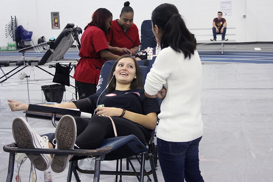 Amanda Guerrero (12) sits in a chair while she donates blood. About 110 people signed up to donate.

