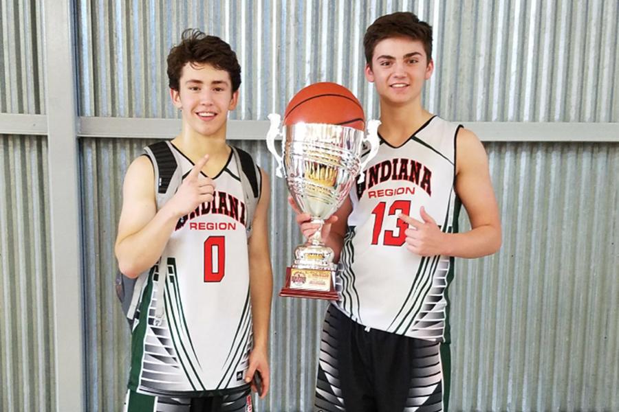Dominic Ciapponi (right) poses with his trophy for his Indiana Elite basketball team. They won the championship at the Bill Hensley Run and Slam Tournament. 