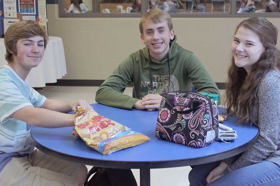Miranda Prowse(10), Nicholas Firlej(10), and Alexander Miller-Swain(10) sit at a lunch table.  They sit here everyday for the school year.

