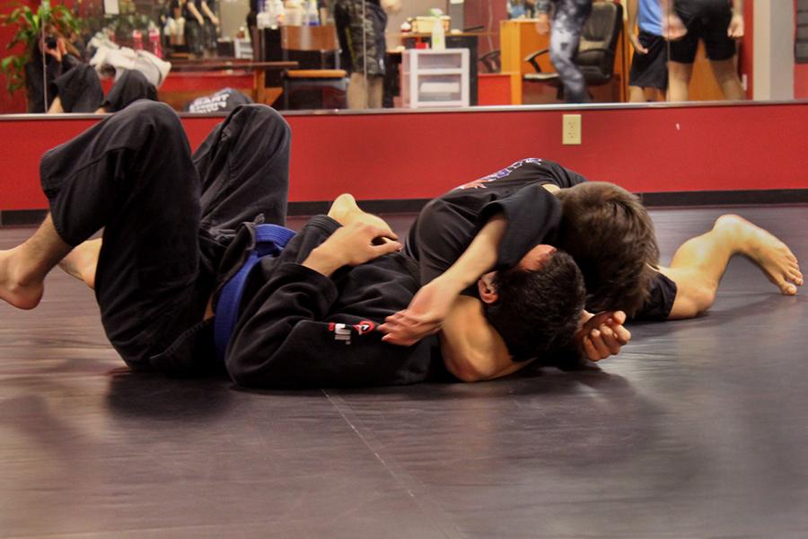 Skrezyna pins down his partner and refuses to let go of his hold.  He spreads his leg to create a stronger hold and buries his head to deny his opponent a chance to reverse the hold.