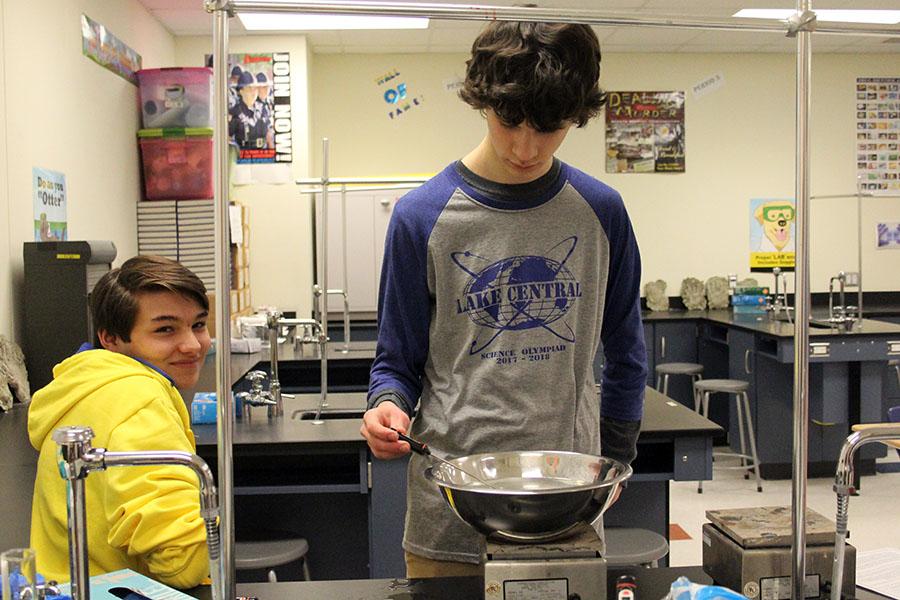  Alan Wright (12) takes the temperature of a bowl of hot water. He ran the thermodynamics event.