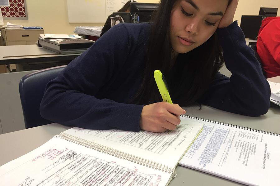 Maruel Yla Caduco (12) studies her CNA book by highlighting key points. Caduco started in the Hammond Career Center just this year. 
