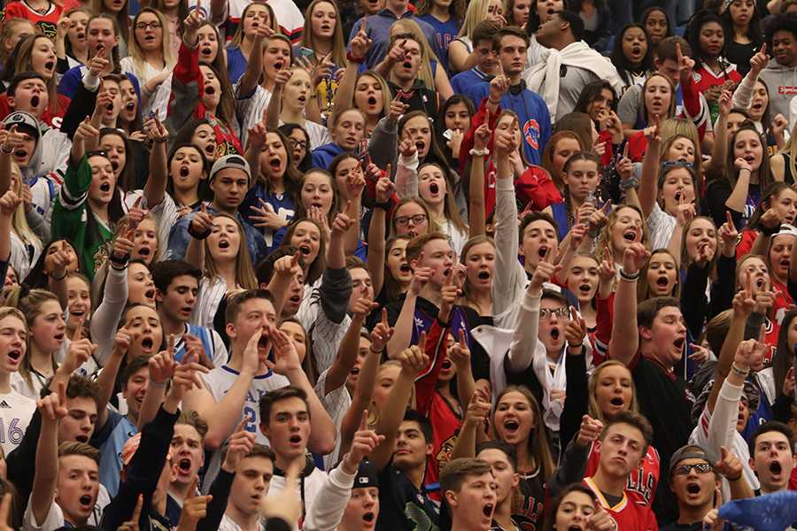 The+student+section+shouts+when+Jack+Davis+%2811%29+makes+a+three+pointer+and+the+Mustangs+call+a+time+out.+The+student+section%E2%80%99s+theme+was+Jersey+Night.+