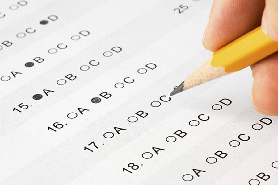 A student bubbles in answers for a multiple choice test. AP exams started on Monday, May 7.
