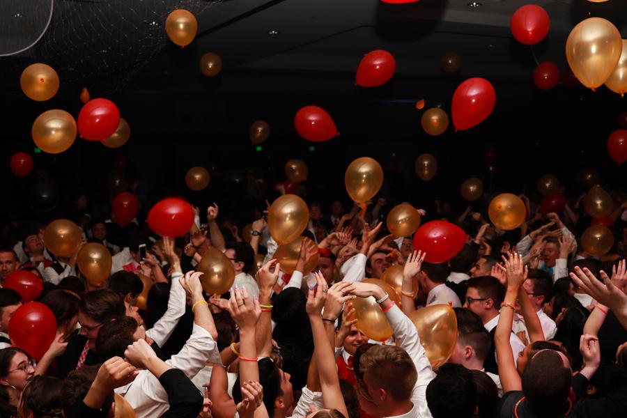 Balloons fall on the crowd following the announcement of the court. A balloon drop was also featured in the prom dance of 2015-2016.