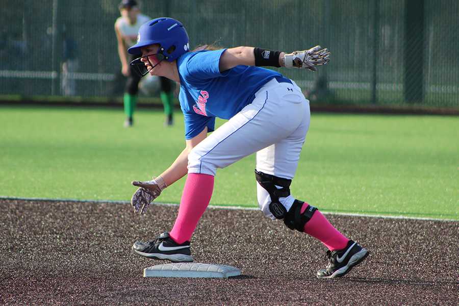Jessica Kiefor (12) gets ready to round third base. She was waiting for her teammate who was up to bat.