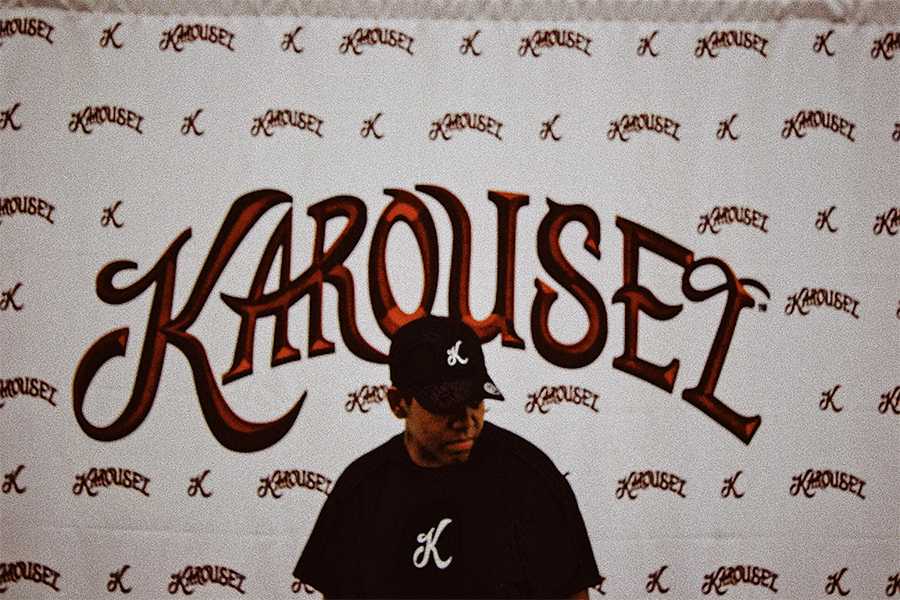 Student posing in front of Karousel custom backdrop. There were more than 4,000 photos taken throughout the night.