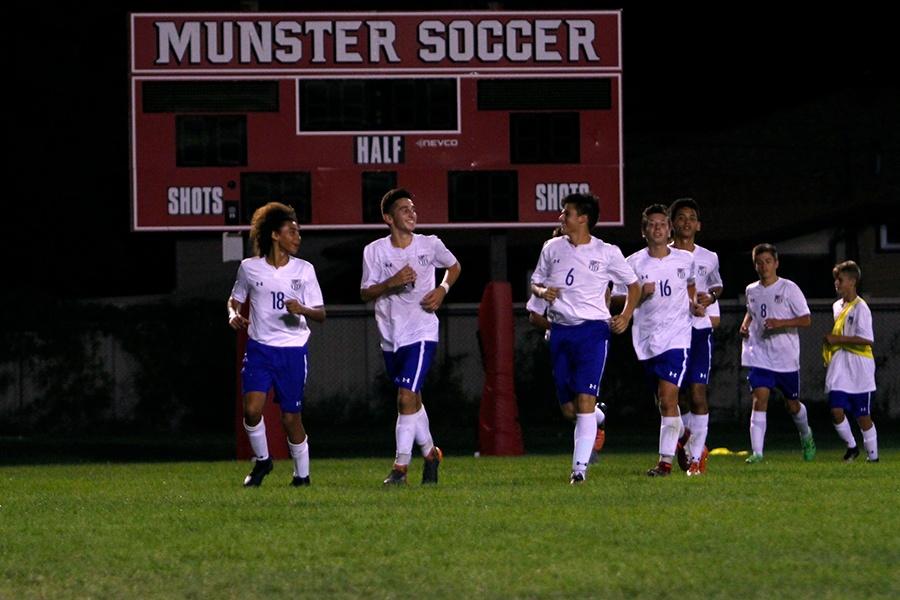 The Boys Varsity Soccer team runs out to the student section. The team won 2-1.