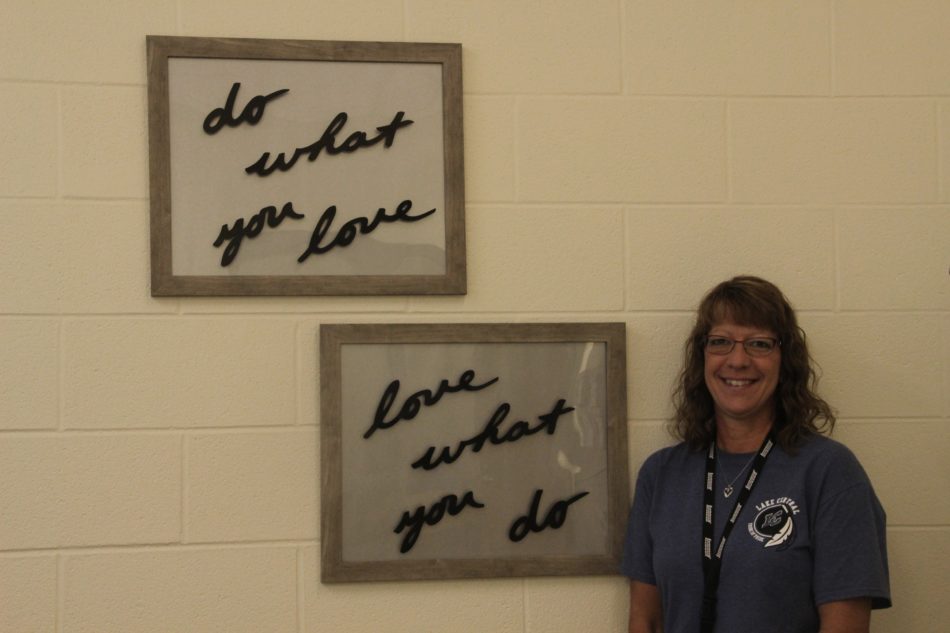  Mrs. Renee Swetlik smiles in her new workspace.  She just redecorated her desk area.