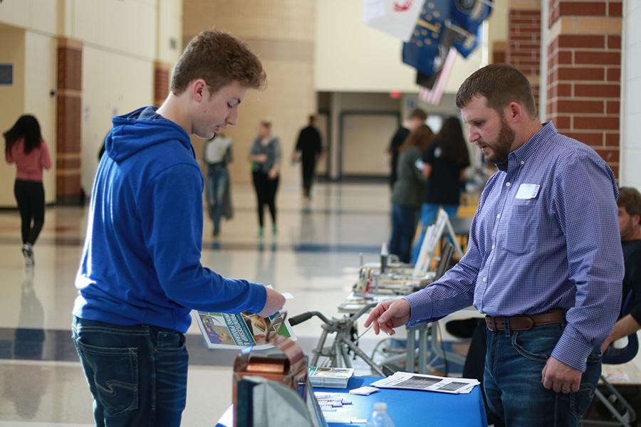 Andrew Smith (12) discusses prospective job opportunities during the Career Expo. Lake Central held a Career Expo during school on Nov. 17, 2017. Photo By: Joshua Chen