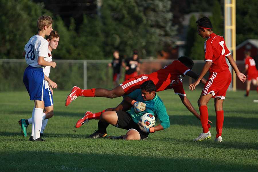 A Munster player dives over Adrian Bernal (9) as he tries to score. Thankfully, Adrian was able to save the ball which prevented them from scoring. 