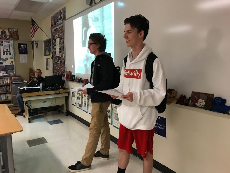  Andrew Gorman (10) and Tommy Serratore (10) talk to Mr. Bryan Szalonek’s PTE class about how students can be involved in the ceremony.  Members of the club went around to PTEs and talked to students about inviting veterans they know to sign up to come to the ceremony and how to get involved in the essay contest. 