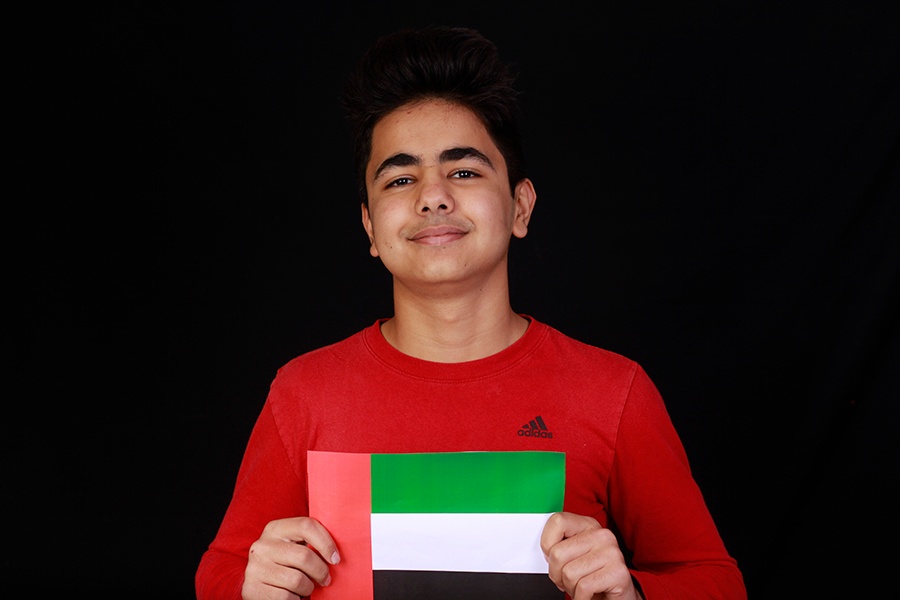 Adam Abudayyeh holds up his countries flag and shows he is proud to be both American and Dubinian. 