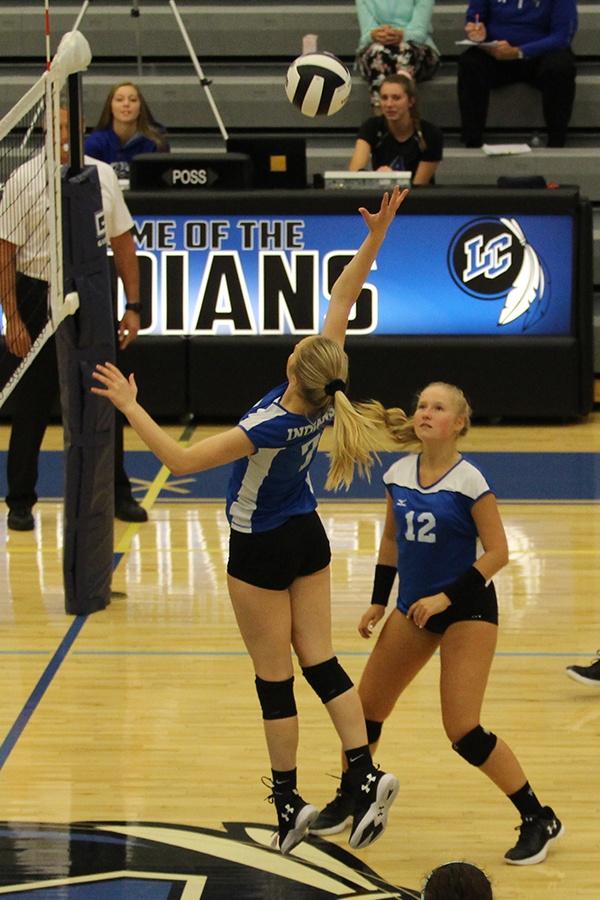 Maddie Chiabai (11) hits a hard ball over the net. She had serval kills during this game against Michigan City.