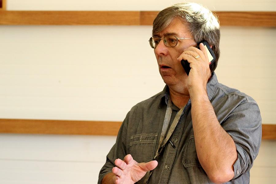 Mr. Tom Clark, Social Studies, speaks on the phone with a donator. Mr. Clark received donations from families across Indiana whose children died in past wars.