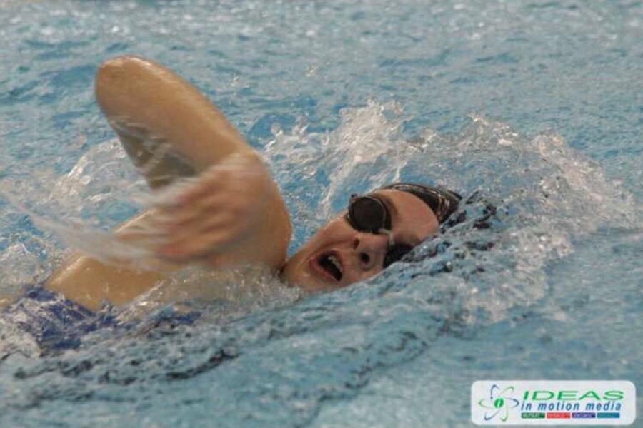Alyssa Todd (11) comes up for air while swimming the freestyle event. Todd enjoyed spending her sophomore year on the swim team and is looking forward for the junior season to start. Photo submitted by: Alyssa Todd