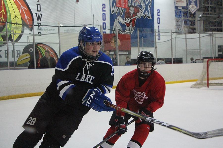 Jack Garson (10) blocks the opponent from getting the puck with the objective of not allowing Crown Point access to it. The Bulldogs ended up scoring four goals.